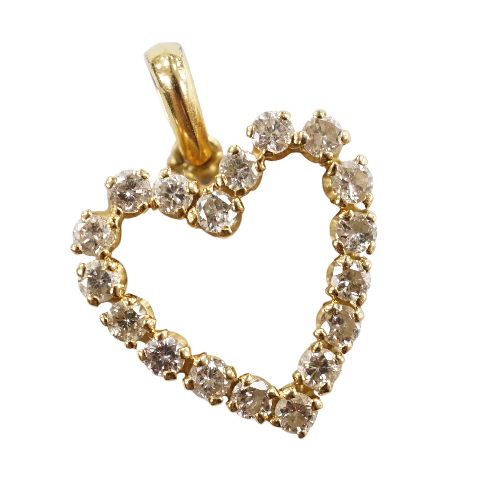 A modern 18k and diamond cluster set open work heart shaped pendant, overall 21mm, gross weight 2.7 grams. Condition - fair to good